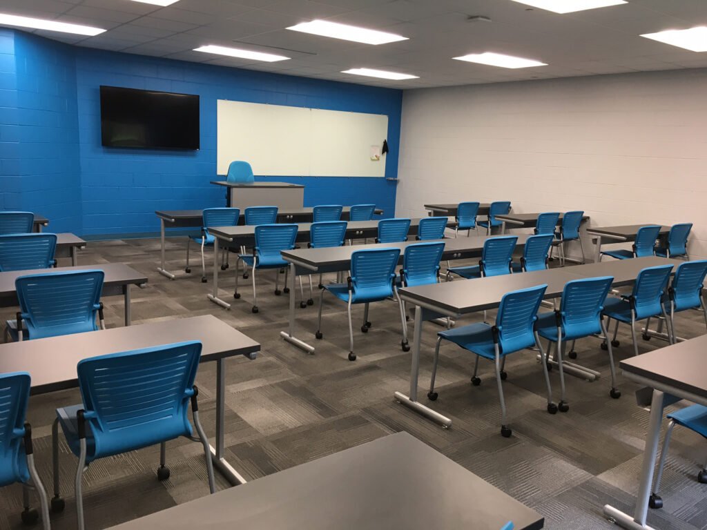 Furniture installation at Jacksonville State University featuring the OM5 Active Guest Chair and Power Lift Lectern.