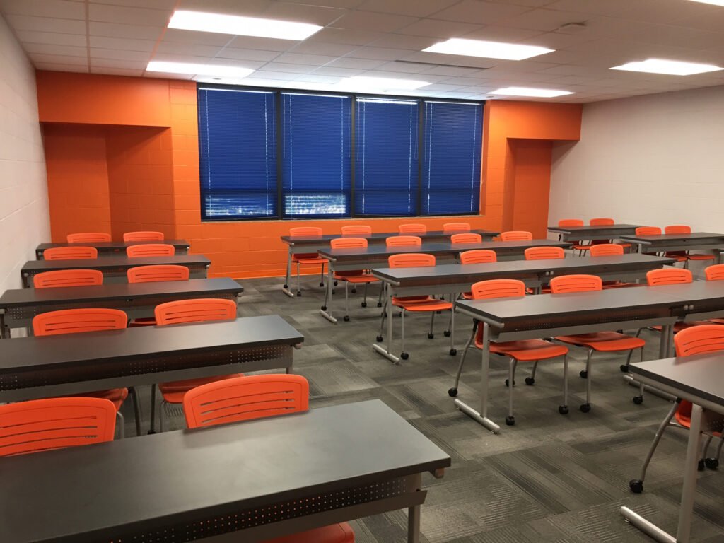 Furniture installation at Jacksonville State University featuring the OM5 Active Guest Chair and Power Lift Lectern.