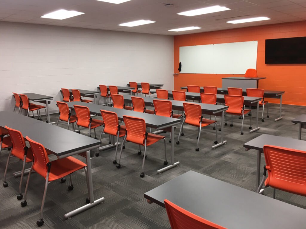 Furniture installation at Jacksonville State University featuring the OM5 Active Guest Chair and Power Lift Lectern.