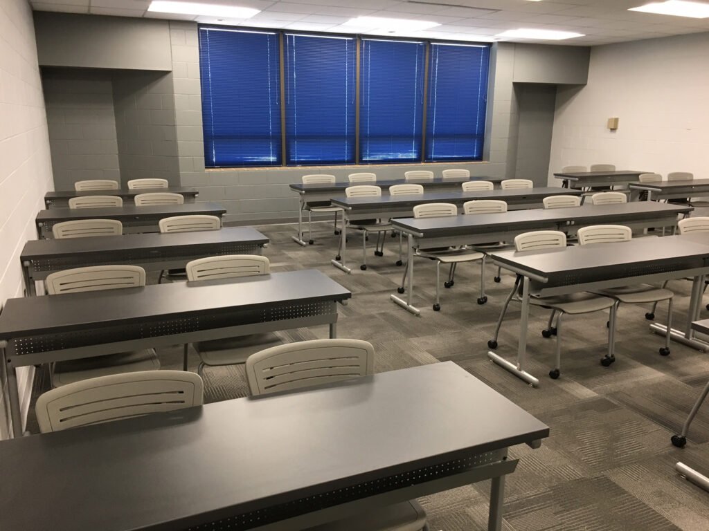 Furniture installation at Jacksonville State University featuring the OM5 Active Guest Chair and Power Lift Lectern.