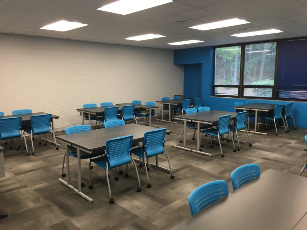 Furniture installation at Jacksonville State University featuring the OM5 Active Guest Chair and Power Lift Lectern.