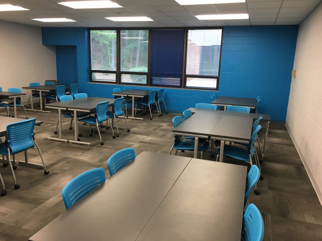 Furniture installation at Jacksonville State University featuring the OM5 Active Guest Chair and Power Lift Lectern.