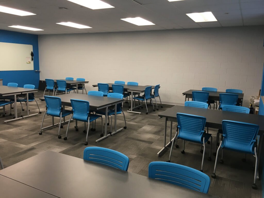Furniture installation at Jacksonville State University featuring the OM5 Active Guest Chair and Power Lift Lectern.