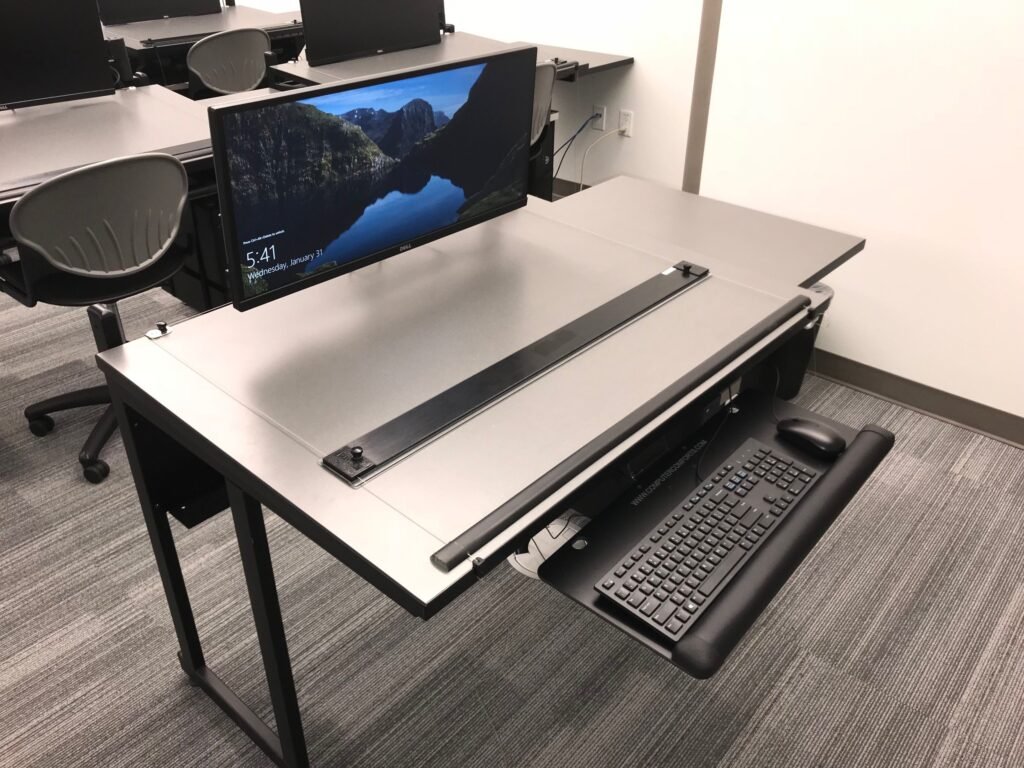 Furniture installation at Lamar State College - Port Arthur featuring the 7000 Articulating Monitor Arm, CAD Drafting Table, RACK2 Fixed CPU Holder and Z-25 Fixed Height Keyboard Platform.