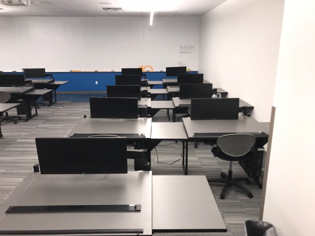 Furniture installation at Lamar State College - Port Arthur featuring the 7000 Articulating Monitor Arm, CAD Drafting Table, RACK2 Fixed CPU Holder and Z-25 Fixed Height Keyboard Platform.