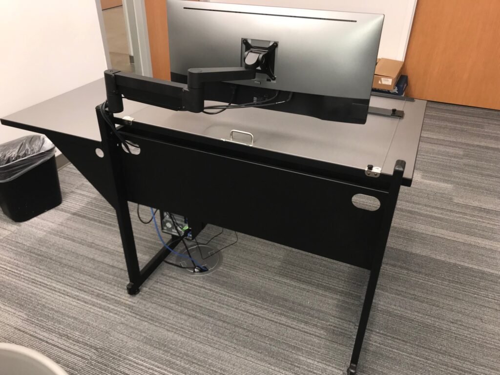 Furniture installation at Lamar State College - Port Arthur featuring the 7000 Articulating Monitor Arm, CAD Drafting Table, RACK2 Fixed CPU Holder and Z-25 Fixed Height Keyboard Platform.