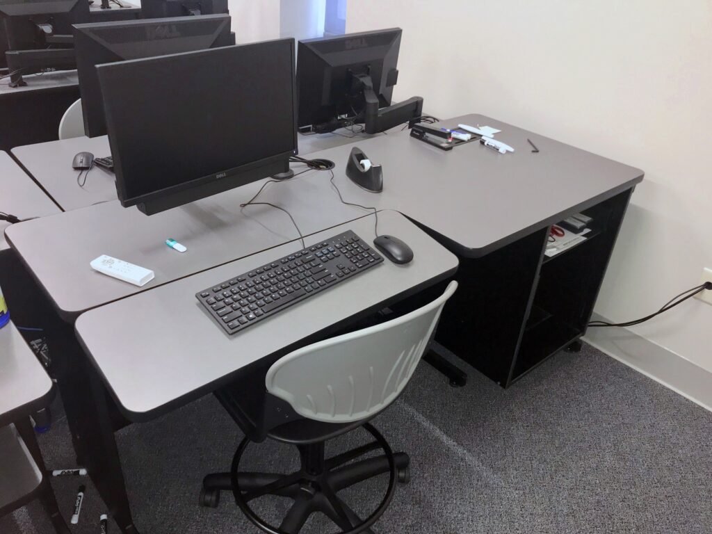 Furniture installation at Lamar State College - Port Arthur featuring the Basic Table, 7000 Articulating Monitor Arm and RACK2 Fixed CPU Holder.