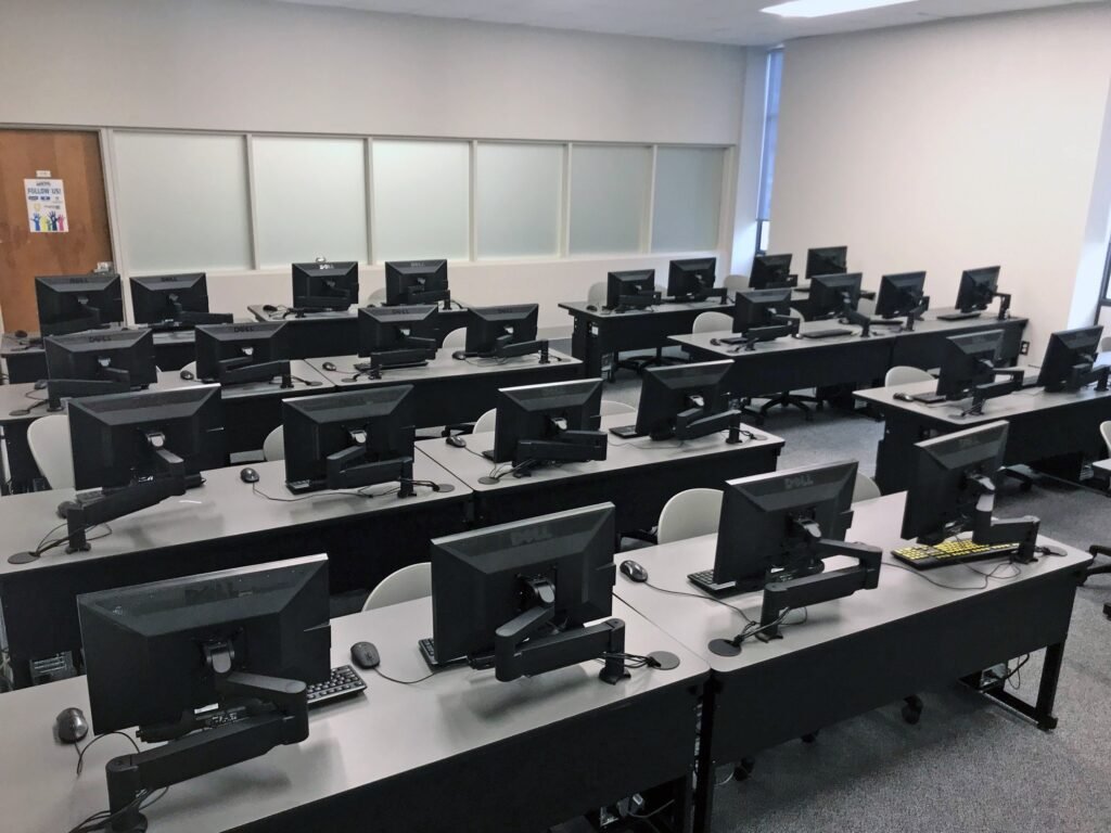 Furniture installation at Lamar State College - Port Arthur featuring the Basic Table, 7000 Articulating Monitor Arm and RACK2 Fixed CPU Holder.