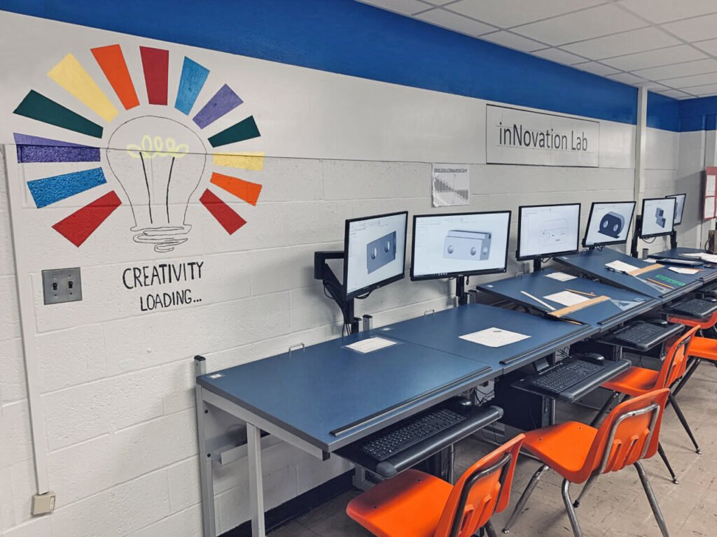 Furniture installation at North Lake High School featuring the CAD Drafting Table, Z-25 Fixed Height Keyboard Platform, 7000 Articulating Monitor Arm and RACK2 Fixed CPU Holder.