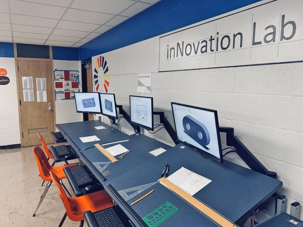 Furniture installation at North Lake High School featuring the CAD Drafting Table, Z-25 Fixed Height Keyboard Platform, 7000 Articulating Monitor Arm and RACK2 Fixed CPU Holder.