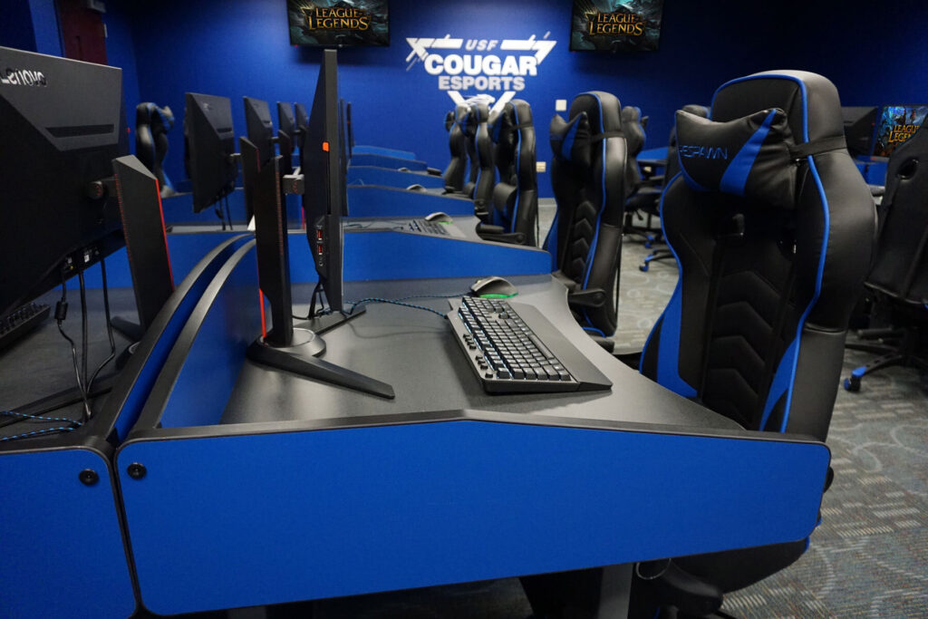 Close up of Computer Comforts' MOBA Esports Gaming Tables with divider panels incorporating team colors.