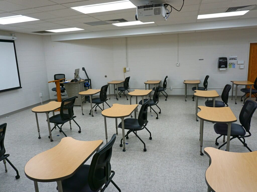 Furniture installation at Saint Mary's College featuring the YS71N Nesting Chair, Koi Table, Universal Lectern 2 and AdapTable Series.