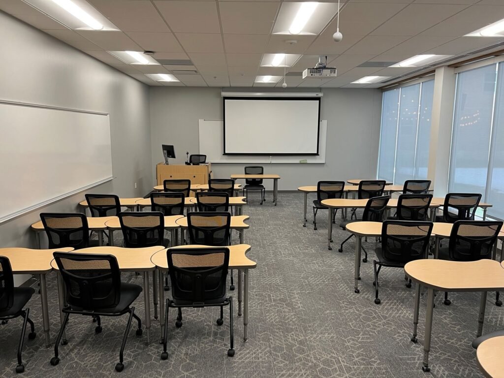 Furniture installation at Saint Mary's College featuring the YS71N Nesting Chair, Koi Table, Universal Lectern 2 and AdapTable Series.