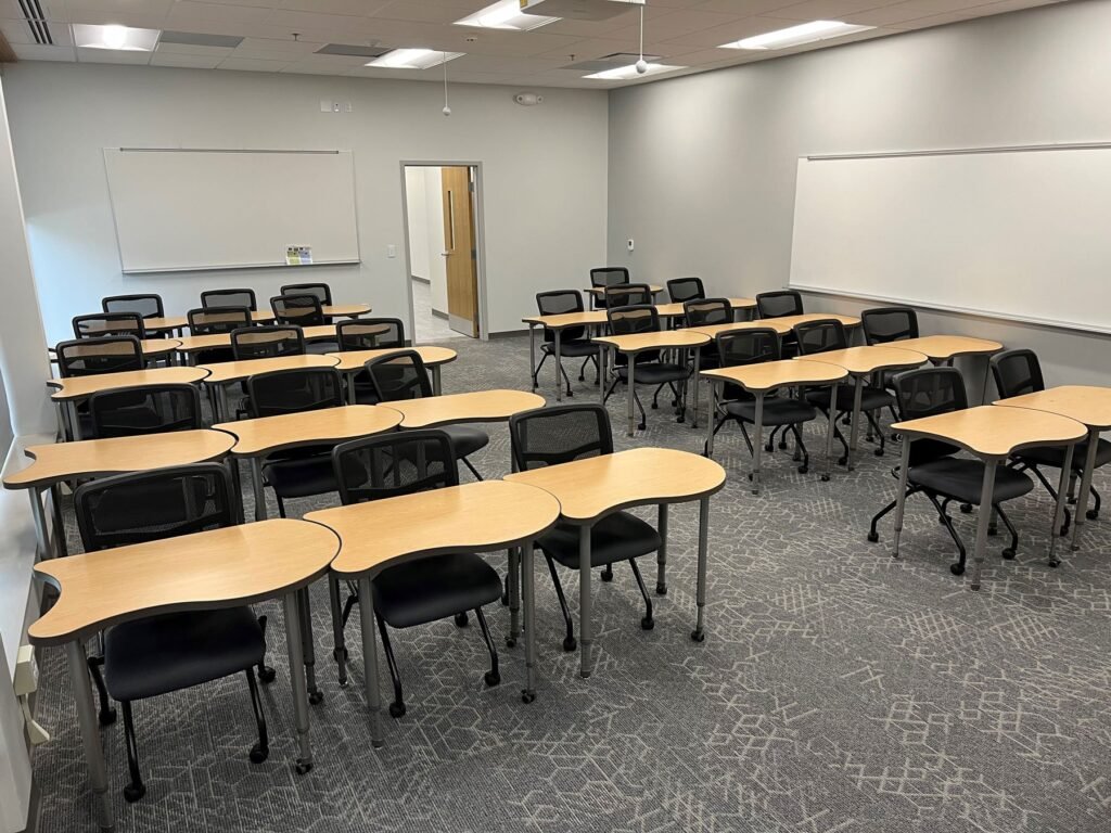 Furniture installation at Saint Mary's College featuring the YS71N Nesting Chair, Koi Table, Universal Lectern 2 and AdapTable Series.