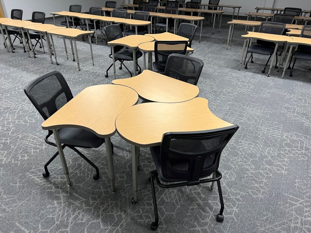 Furniture installation at Saint Mary's College featuring the YS71N Nesting Chair, Koi Table, Universal Lectern 2 and AdapTable Series.