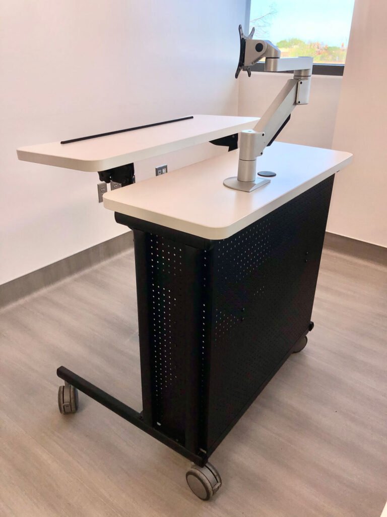 Computer Comforts' Freedom Instructor Cart shown with a fully articulating monitor arm.