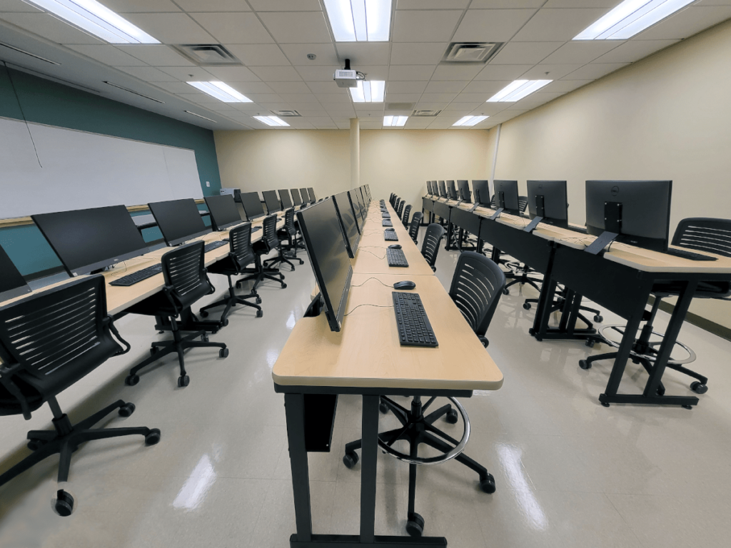 Computer Comforts' Tiered LCD Secure Student Tables (Tier Secure) and OM5 Active Task Stools at Cayuga Community College