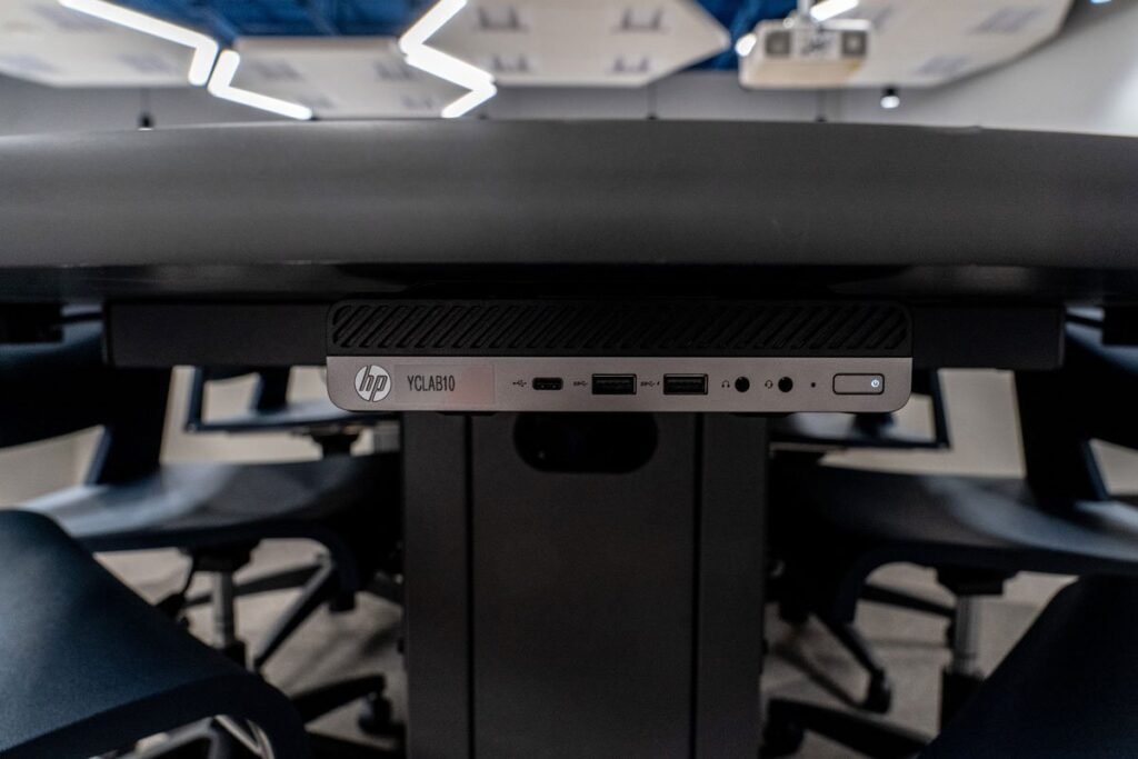 Close-up view of HP Elite Mini Computer mounted to Computer Comforts' Collaborative Table
