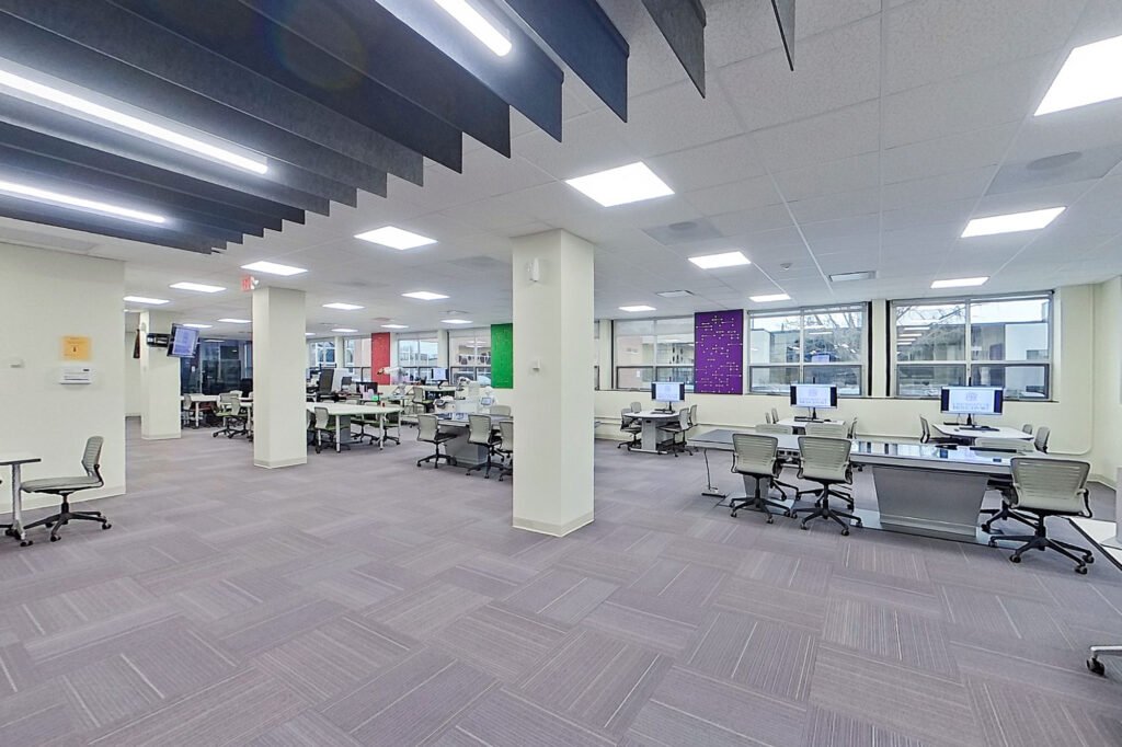 Furniture installation at University of Bridgeport featuring the Coligo Acoustic Panels, Collaborative Table Series, AdapTable Series, Addo Acoustic Panels and OM5 Active Task Chair.