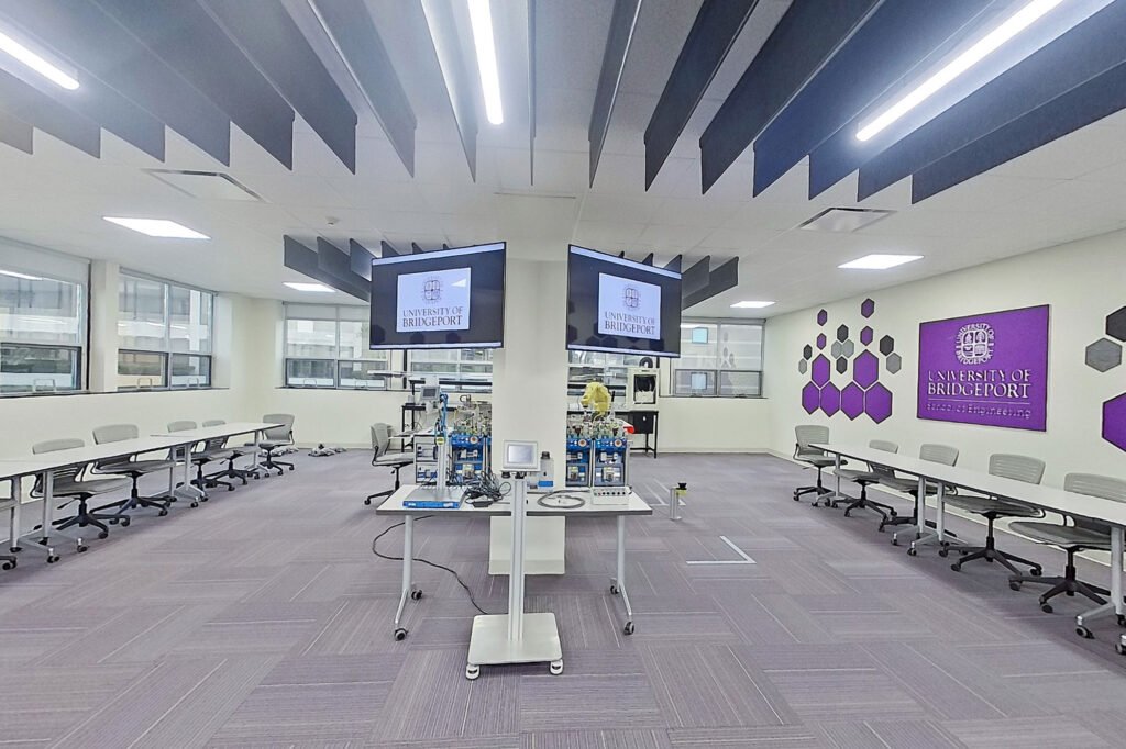 Furniture installation at University of Bridgeport featuring the Coligo Acoustic Panels, Collaborative Table Series, AdapTable Series, Addo Acoustic Panels and OM5 Active Task Chair.