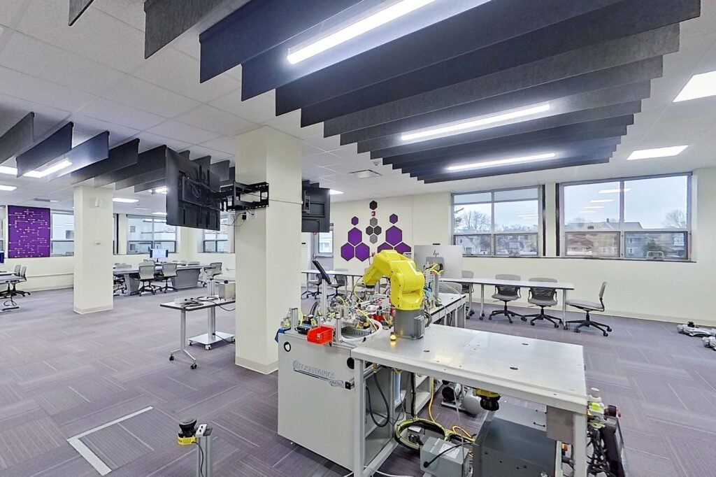 Furniture installation at University of Bridgeport featuring the Coligo Acoustic Panels, Collaborative Table Series, AdapTable Series, Addo Acoustic Panels and OM5 Active Task Chair.