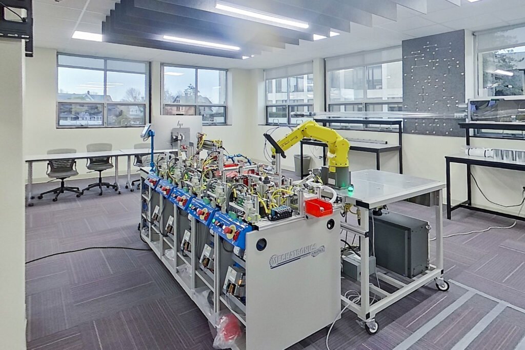 Furniture installation at University of Bridgeport featuring the Coligo Acoustic Panels, Collaborative Table Series, AdapTable Series, Addo Acoustic Panels and OM5 Active Task Chair.