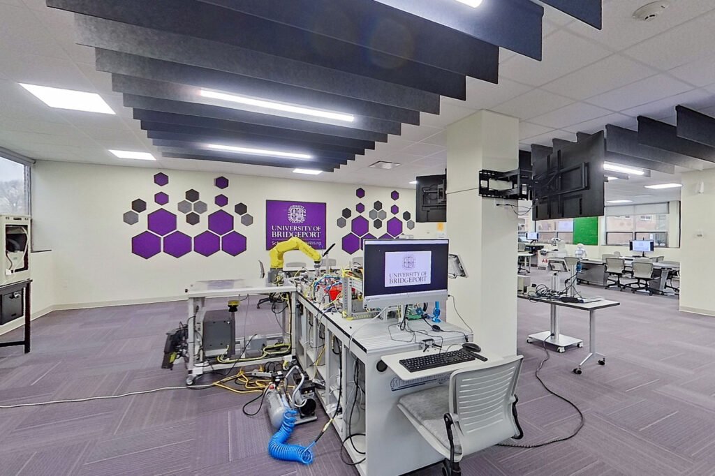 Furniture installation at University of Bridgeport featuring the Coligo Acoustic Panels, Collaborative Table Series, AdapTable Series, Addo Acoustic Panels and OM5 Active Task Chair.