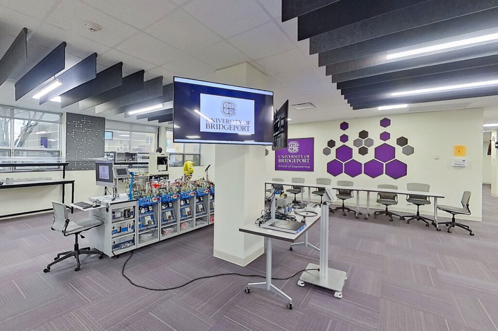Furniture installation at University of Bridgeport featuring the Coligo Acoustic Panels, Collaborative Table Series, AdapTable Series, Addo Acoustic Panels and OM5 Active Task Chair.