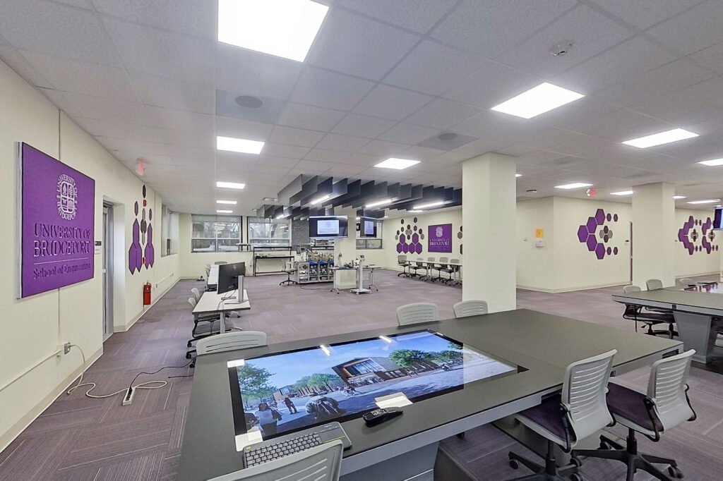 Furniture installation at University of Bridgeport featuring the Coligo Acoustic Panels, Collaborative Table Series, AdapTable Series, Addo Acoustic Panels and OM5 Active Task Chair.