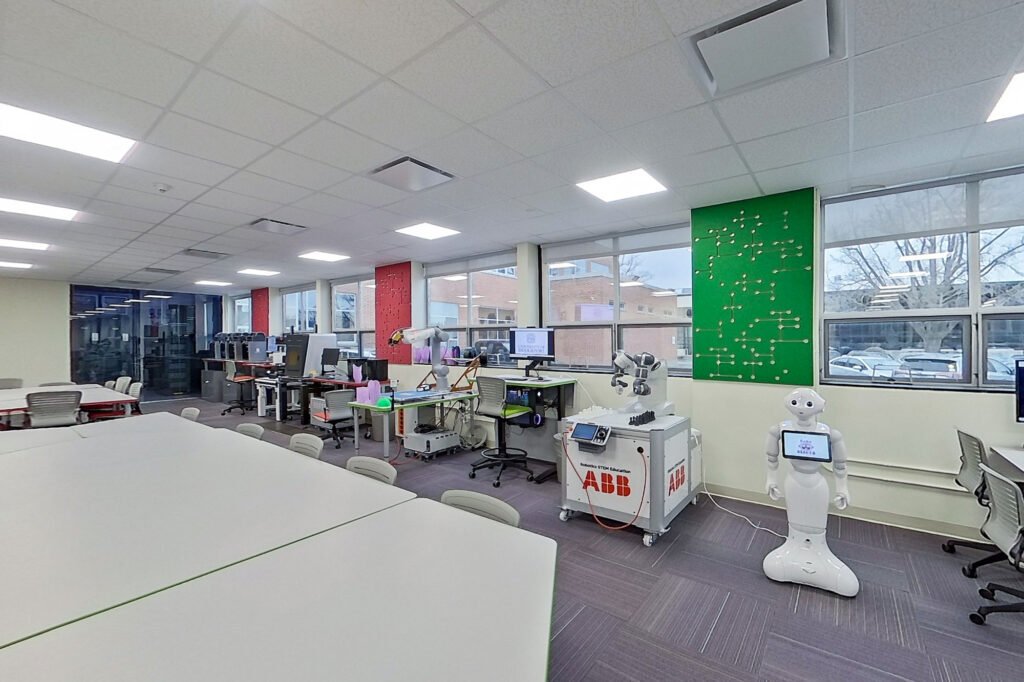 Furniture installation at University of Bridgeport featuring the Coligo Acoustic Panels, Collaborative Table Series, AdapTable Series, Addo Acoustic Panels and OM5 Active Task Chair.