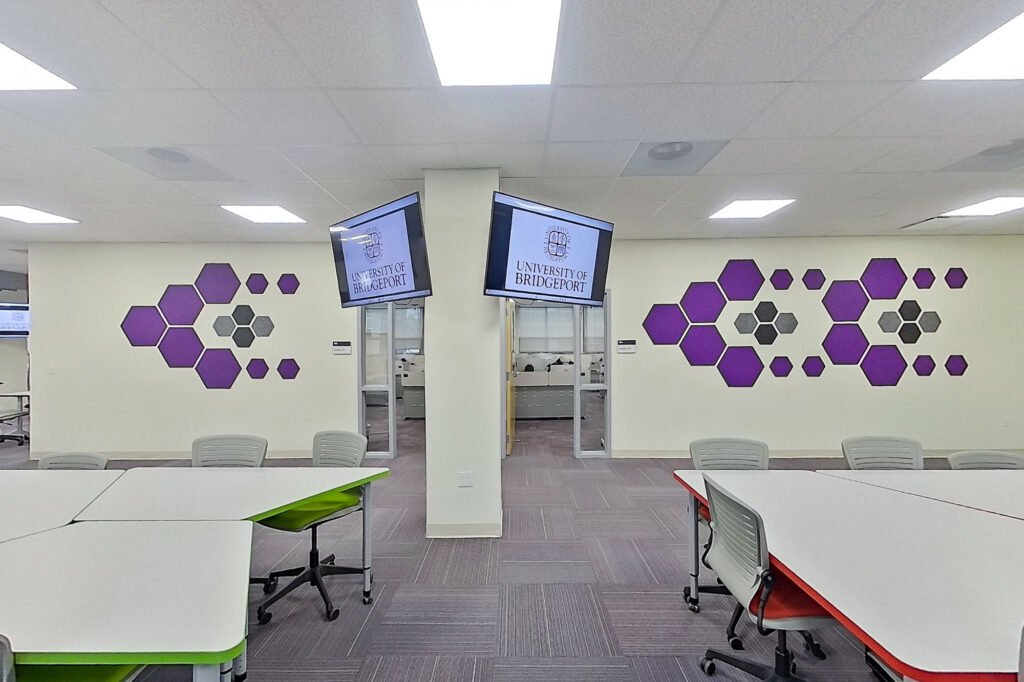 Furniture installation at University of Bridgeport featuring the Coligo Acoustic Panels, Collaborative Table Series, AdapTable Series, Addo Acoustic Panels and OM5 Active Task Chair.