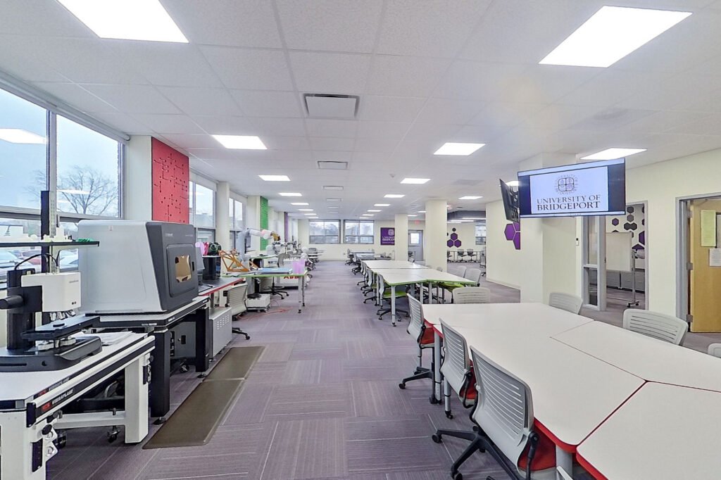 Furniture installation at University of Bridgeport featuring the Coligo Acoustic Panels, Collaborative Table Series, AdapTable Series, Addo Acoustic Panels and OM5 Active Task Chair.
