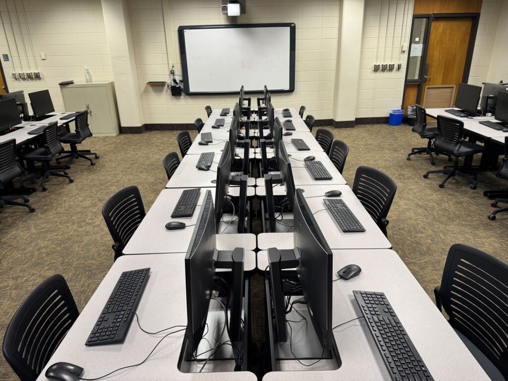 Furniture installation at UNC Greensboro featuring the OM5 Active Task Chair, Node and Recessed LCD Table.