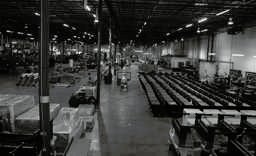 Team members working on furniture frames at CCI